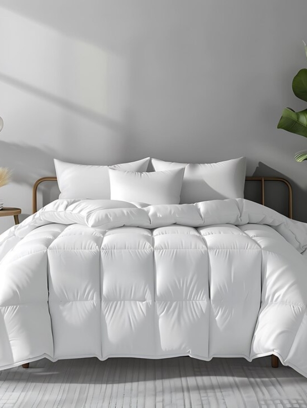 close-up-bed-with-white-comforter-pillows_1034997-115983