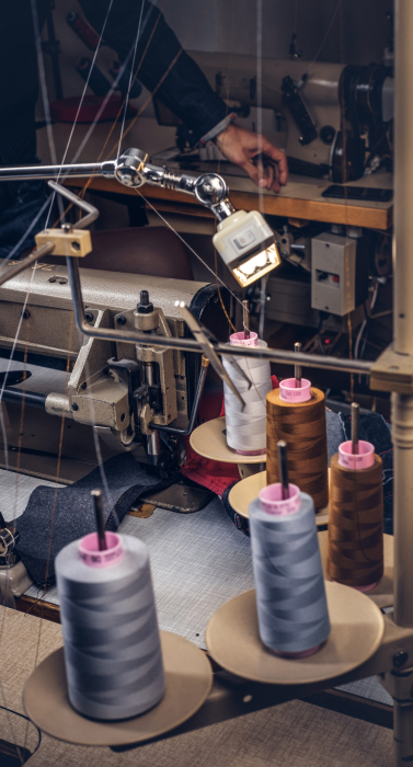 Picture of a tailor's desktop at a sewing workshop.