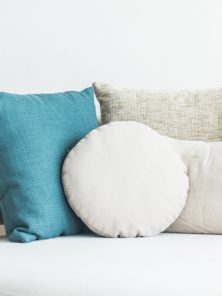 Beautiful pillow on sofa decoration in living room interior