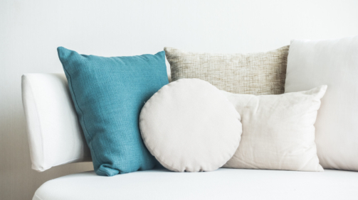 Beautiful pillow on sofa decoration in living room interior