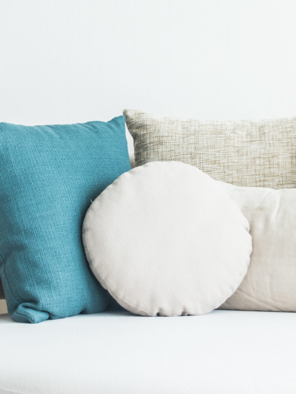 Beautiful pillow on sofa decoration in living room interior